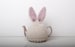 Hand knitted bunny rabbit tea cosy with pom pom bottom. Fits either 6 cup or 2 cup tea pots. 