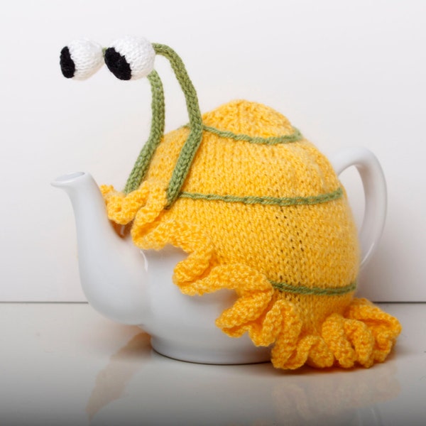 Knitted yellow snail tea cosy with frilly bottom. 6 cup and 2 cup sizes. Washable.