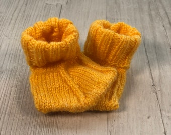 Duck feet baby booties hand knitted by Ruperts House.