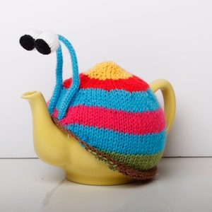 Knitted blue stripy snail tea cosy. Tea lovers teatime treat.