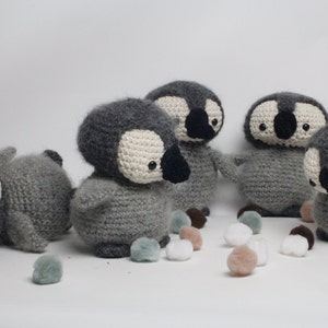 Amigurumi crochet penguin hand crochet from worsted yarn. Perfect Christmas decoration.