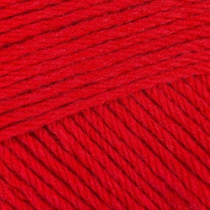 May include: Close-up of a red yarn with a textured surface. The yarn is made of soft fibers and has a slightly fuzzy appearance.
