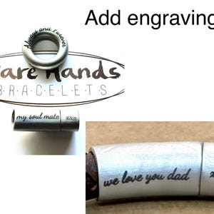 a bracelet with engraved text, including a message about a father and a message about a soul mate. The bracelet is silver and has a metal clasp.