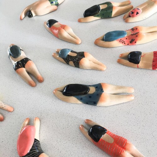 Unique handmade ceramic swimmer magnets by Artist Junty