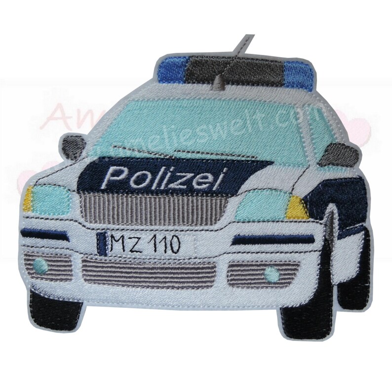 May include: Embroidered patch of a police car in white, light blue, and navy blue. The word "Polizei" is embroidered across the front. The car has blue lights on top and the license plate reads "MZ 110".