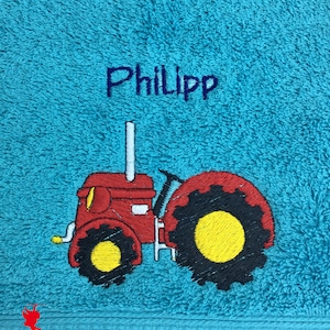 Serviette de tracteur brodée avec motif nom hellblau/türkisblau