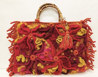 Hand-knitted autumn/winter wool bag in mustard, burgundy and red.
