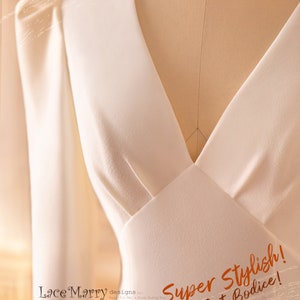 May include: A white bodice with an X-shaped cut at the front. The bodice is on a dress form and the text "Super Stylish! X-Cut Bodice!" is written in orange on the bodice. The text "Lace Marry designs by Mary Jin Mei & Gina Guang Hu" is written in black at the bottom of the image.