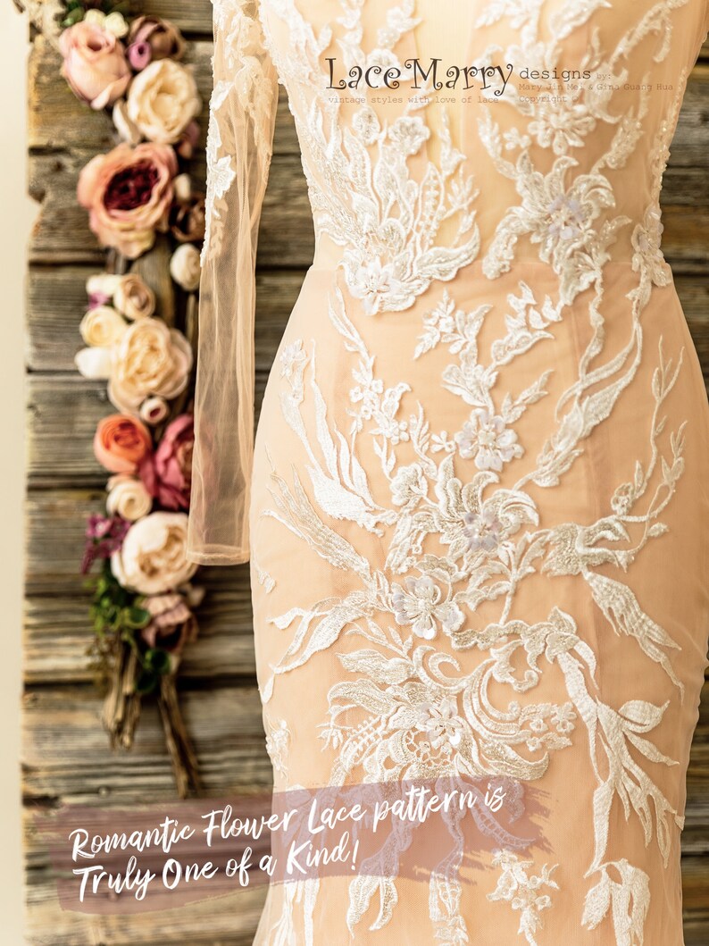 May include: A close-up of a white lace wedding dress with a floral pattern. The dress has long sleeves and a fitted bodice. The text "Lace Marry designs" and "Romantic Flower Lace pattern is Truly One of a Kind!" is visible on the image.