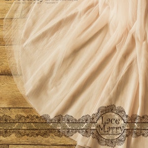May include: A close-up of a pale peach tulle fabric with a delicate, intricate lace trim. The fabric is draped over a wooden surface. The text "Lace Marry designs by Mary Jin Mel & Gina Quang Hua vintage styles with love of lace Copyright &copy;" is visible at the top of the image. The text "Lace Marry lacemarty.etsy.com" is visible at the bottom of the image.