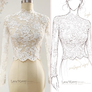 May include: A white lace top with long sleeves and a high collar is displayed on a mannequin. The intricate floral lace design is visible. A sketch of the top is shown next to the mannequin, with the words "high collar" and "scalloped edges."