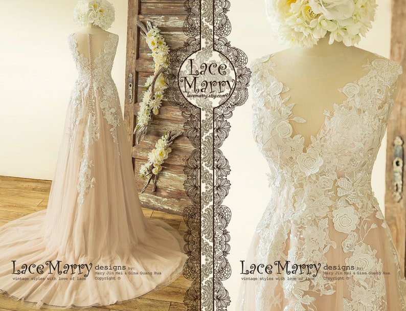 May include: A blush pink tulle wedding dress with white lace appliques and a V-neckline. The dress has a full skirt and a long train. The dress is on a mannequin in a studio setting. "Lace Marry designs by Mary Jin Bai & Gina Guang Hua. Vintage styles with love of lace. Copyright &copy;"