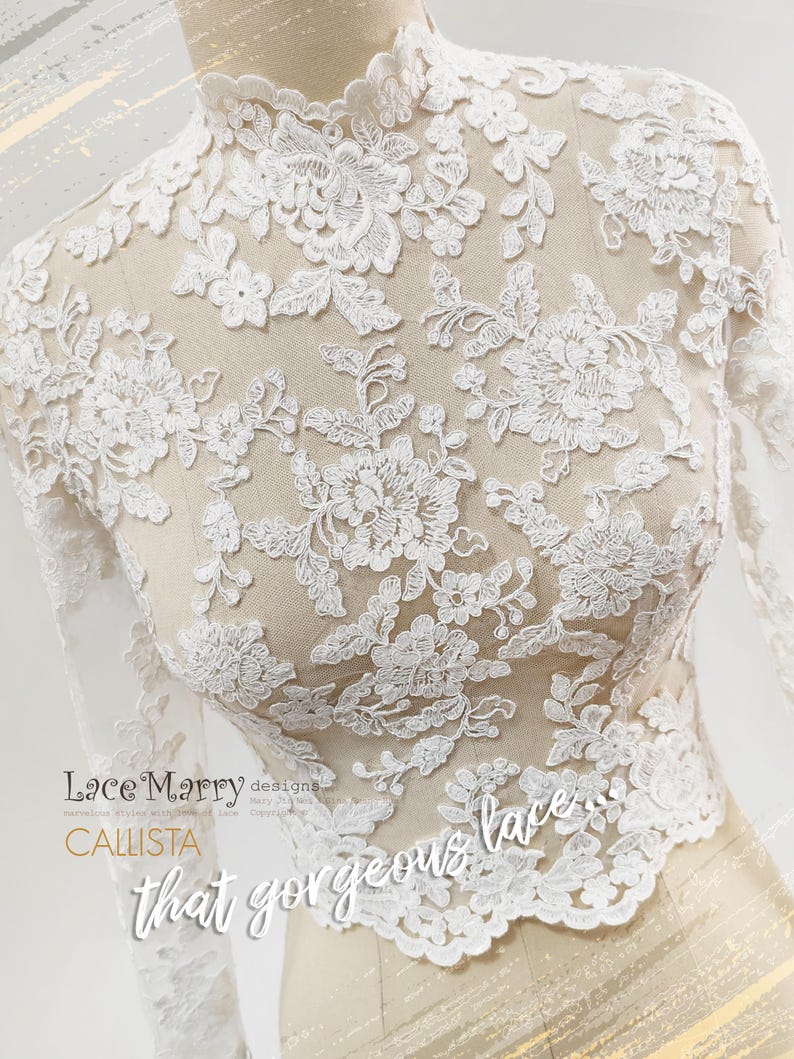 May include: A white lace top with long sleeves and a high neckline, displayed on a mannequin. The intricate floral lace design is visible, with the words "Lace Marry designs" and "CALLISTA" in the image.