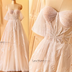 MELINA / Suknia ślubna z odkrytymi ramionami i linią A, z koralikowymi aplikacjami kwiatowymi, sznurowana