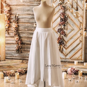 Two Piece Wedding Dress Set from Lightly Beaded Transparent Crop Top with 3D Flower Applique and Ample High Low Skirt in Folded Modern Cut Only Skirt