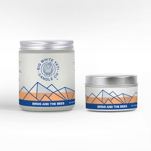 May include: Two candles with a mountain range design and the text "Big White Yeti Candle Co." and "Birds and the Bees".