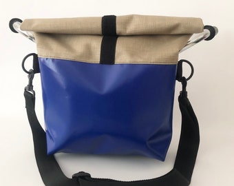 Large, waterproof handlebar bag with detachable, adjustable strap