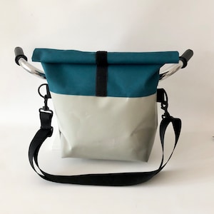 Large, waterproof handlebar bag with removable, adjustable strap