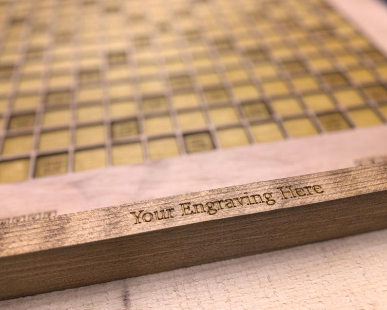 May include: A wooden board with a grid pattern and the text "Your Engraving Here" engraved on the bottom edge.