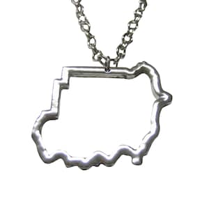 May include: A silver pendant necklace depicting the outline of a country. The pendant hangs from a fine chain. The design is minimalist, highlighting the distinctive shape of the country in a contemporary style.