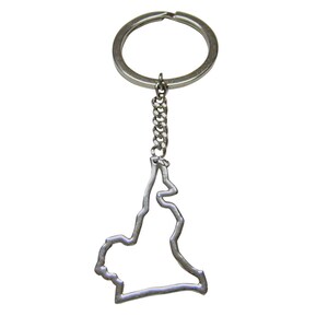 May include: Silver keychain shaped like the outline of the state of Louisiana.