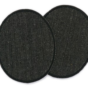 May include: Two black fabric patches with a rounded oval shape and a black stitched border.