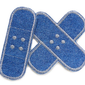 May include: Three blue denim fabric band-aid patches with white stitching and gray dots.