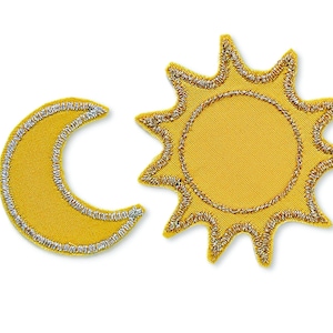 May include: Two yellow felt patches, one shaped like a crescent moon and the other like a sun with rays. Both patches have a silver outline.