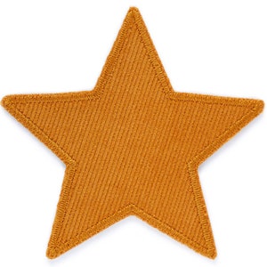 Può includere: Un grande cerotto a forma di stella a cinque punte realizzato in tessuto arancione testurizzato.