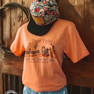 Cowgirl Cadillacs T-shirt in Peach