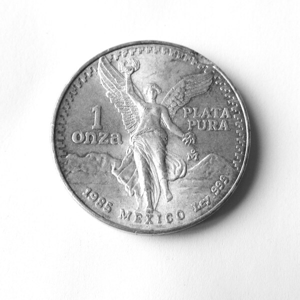 1985 Mexican Libertad / One Oz. (1 Onza) Silver Coin / Pure Silver (PLATA PURA) / Obv. Winged Liberty / Rev. Eagle  & Snake / Collectible