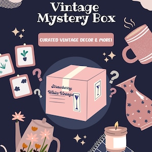 May include: A navy blue graphic with the text "Vintage Mystery Box" and "Curated Vintage Decor & More!". The image features a pink box, a teapot, a mug, a vase, a candle, and other vintage decor items.