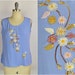 see more listings in the { tops } section