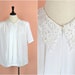 see more listings in the { tops } section