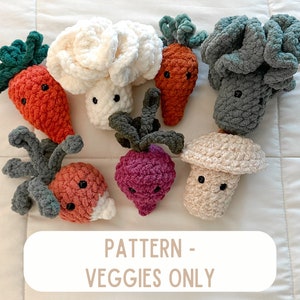 May include: A set of crocheted amigurumi vegetables, including a carrot, cauliflower, mushroom, beetroot, and two broccoli. The vegetables have cute faces and are made with different coloured yarn.