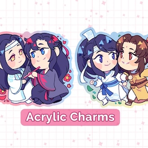 May include: Two sets of anime-style character charms. The first set features two characters with black hair, one in a white and blue outfit and the other in a black and red outfit. The second set features two characters with blue hair, one in a white and blue outfit and the other in a yellow and brown outfit. The text "Acrylic Charms" is below the images.
