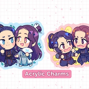 May include: Two sets of acrylic charms featuring anime-style characters. The first set shows two characters with purple hair, one in a blue and white outfit and the other in a black and red outfit. The second set shows two characters with purple and brown hair, both in black and blue outfits. The text "Acrylic Charms" is printed below the images.