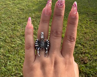Stainless steel scorpion ring.