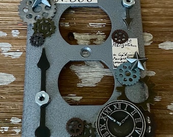 Gunmetal Industrial / Steampunk outlet cover is handcrafted made from assorted recycled materials. please read description.