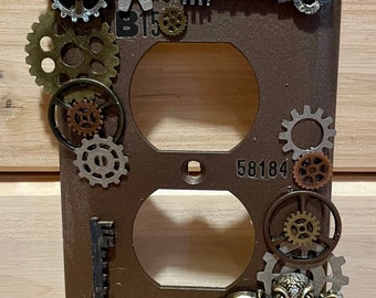 Bronze Industrial / Steampunk outlet cover is individually handcrafted made from assorted recycled materials. please read description.