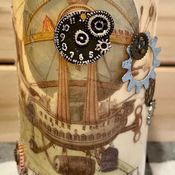 Industrial Steampunk themed battery operated candle. 2 1/2 x5" pillar. Replacement batteries can be bought @ the dollar tree