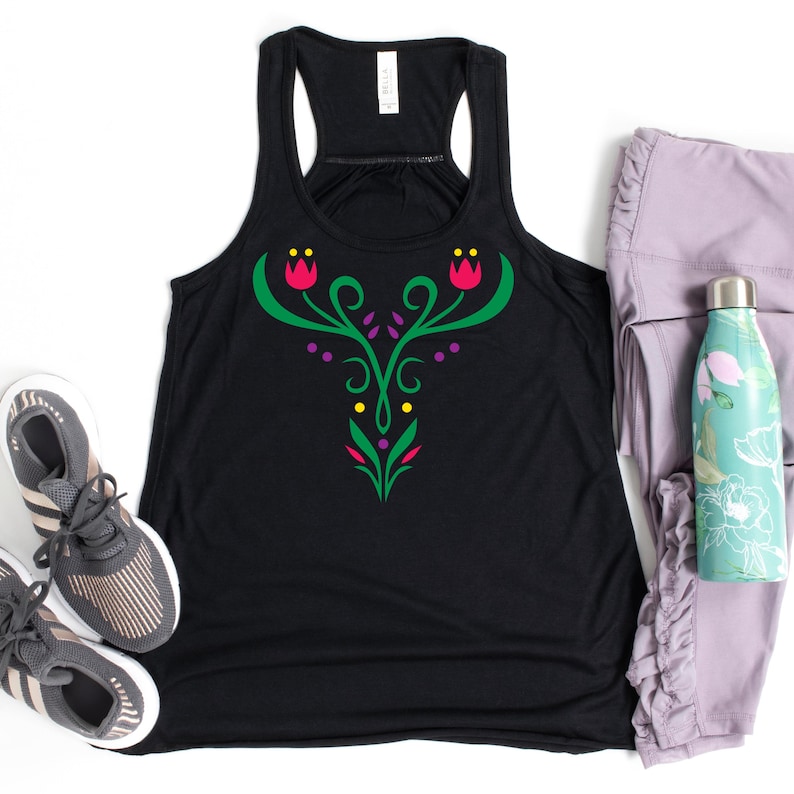 May include: Black racerback tank top with a floral design in green, pink, purple, and yellow. The tank top is paired with gray sneakers, lavender leggings, and a floral water bottle.