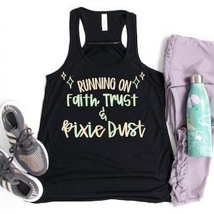May include: Black racerback tank top with the text "RUNNING ON Faith, Trust & Pixie Dust" in pastel colors. The image also includes gray athletic shoes, lavender leggings, and a floral water bottle.