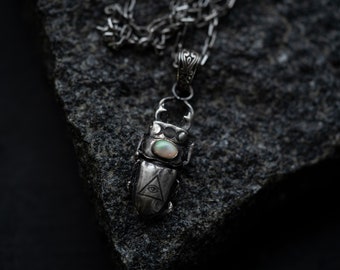 Silver stag beetle necklace with opal engraved wicca moon phase and triangle symbol. Witch occult pendant