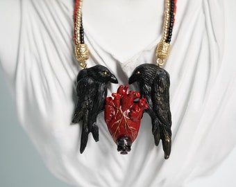 Statement necklace ravens on the heart. Black pearl skull