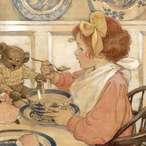 May include: A young girl with red hair and a yellow bow sits at a table with a teddy bear, a doll, and a bowl of soup. She is holding a spoon and looking at the soup. The table is covered with a white tablecloth and there is a plate with a piece of bread on it.