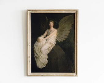 May include: A framed vintage painting of an angel with large wings, wearing a flowing white gown, and seated on a dark rock. The artwork has a gold-toned frame and a dark background. The word "VAE" is visible on the rock.