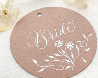 Circular wedding place names with hand calligraphy, made in the UK from sustainable recycled card
