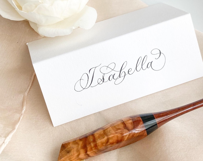 Featured listing image: Pristine white wedding place names, tent folded with calligraphy