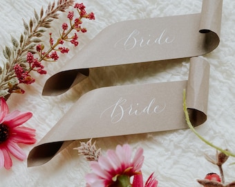 Scroll wedding place cards on recycled paper